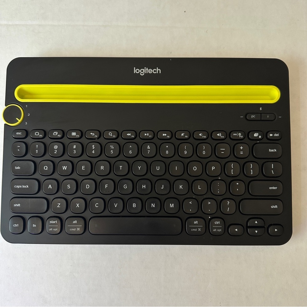Logitech Black Keyboard with Yellow Slot